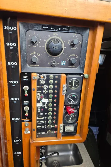 Bearaway Yacht Photos Pics Electrical control panel on a 1985 Amel Maramu sailboat, featuring gauges and switches.