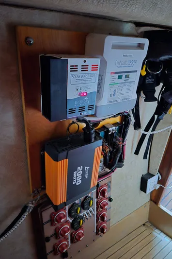 Bearaway Yacht Photos Pics Electrical panel on a 1985 Amel Maramu sailboat with inverter and charge controller.