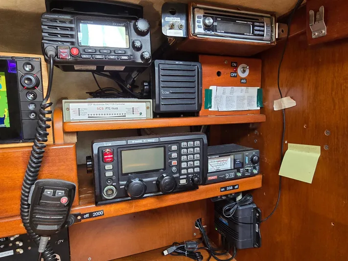 Bearaway Yacht Photos Pics Radio and navigation equipment on 1985 Amel Maramu sailboat control panel.