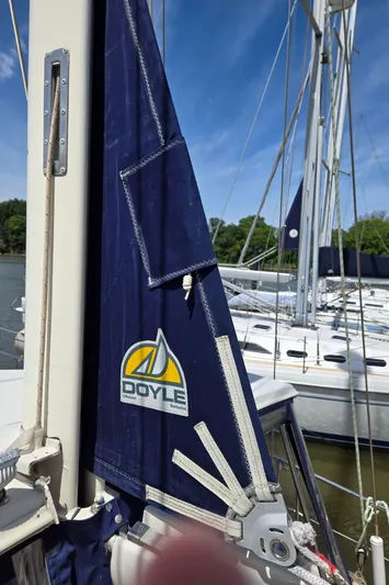 Bearaway Yacht Photos Pics Sailboat with Doyle sail, Amel Maramu 1985, docked under clear blue sky.