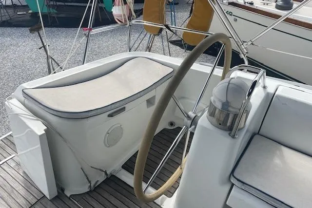 Ligera Yacht Photos Pics Cockpit of 2002 Jeanneau Sun Odyssey 45.2 sailboat with steering wheel and seating.