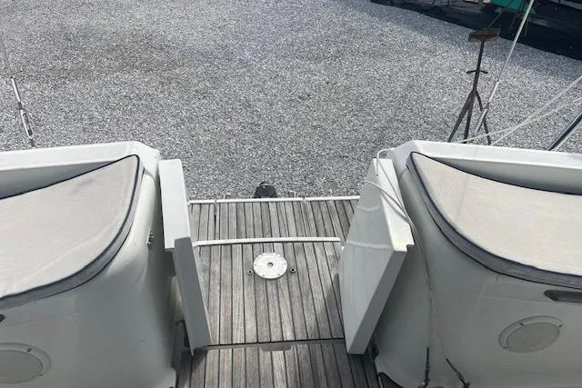 Ligera Yacht Photos Pics Jeanneau Sun Odyssey 45.2 yacht deck, 2002 model, featuring cushioned seating and wooden flooring.