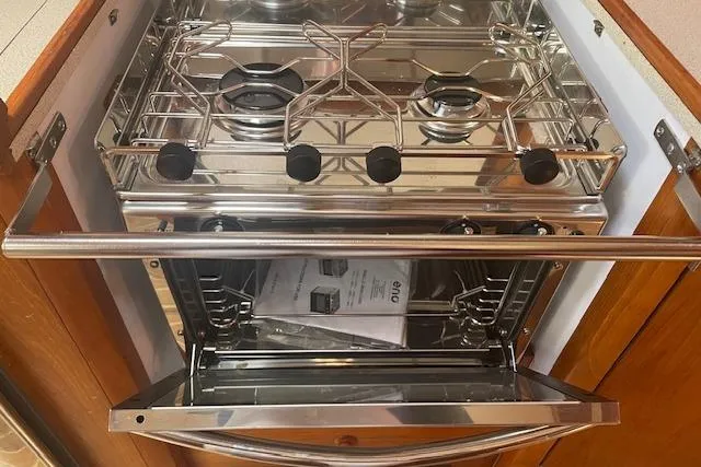 Ligera Yacht Photos Pics Stainless steel stove and oven in Jeanneau Sun Odyssey 45.2 yacht kitchen, 2002 model.