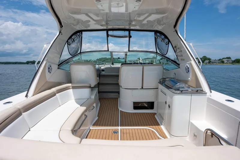 Latitude Adjustment Yacht Photos Pics 2013 Sea Ray 370 Sundancer boat interior with seating, helm, and water view.