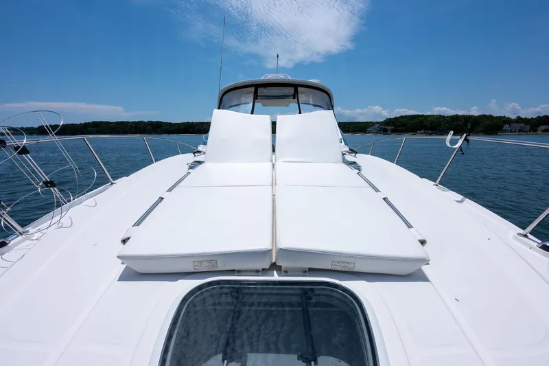 Latitude Adjustment Yacht Photos Pics 2013 Sea Ray 370 Sundancer yacht with sun loungers on deck, cruising on a sunny day.