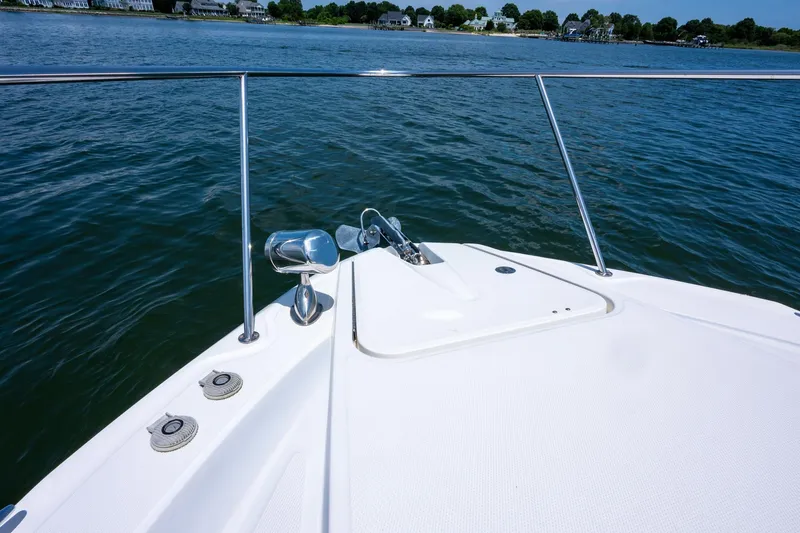 Latitude Adjustment Yacht Photos Pics Bow of 2013 Sea Ray 370 Sundancer yacht on calm water.