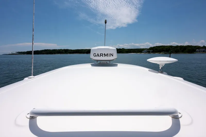 Latitude Adjustment Yacht Photos Pics Bow view of 2013 Sea Ray 370 Sundancer with Garmin equipment, cruising on calm waters.