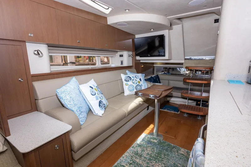 Latitude Adjustment Yacht Photos Pics Luxurious interior of 2013 Sea Ray 370 Sundancer yacht with modern furnishings and decor.