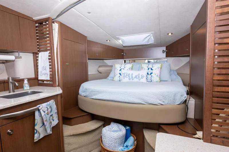Latitude Adjustment Yacht Photos Pics Luxurious interior of 2013 Sea Ray 370 Sundancer with cozy bed and modern amenities.