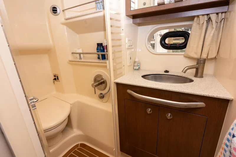 Latitude Adjustment Yacht Photos Pics Luxurious bathroom in 2013 Sea Ray 370 Sundancer yacht with sink and shower.