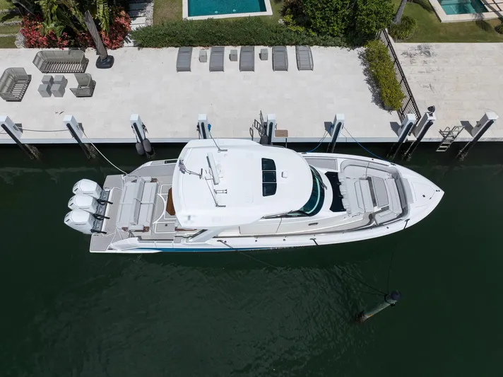  Yacht Photos Pics 2023 Tiara Yachts 48 LS docked, aerial view showcasing sleek design and triple engines.