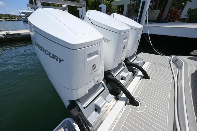  Yacht Photos Pics 2023 Tiara Yachts 48 LS with dual Mercury outboard engines docked.