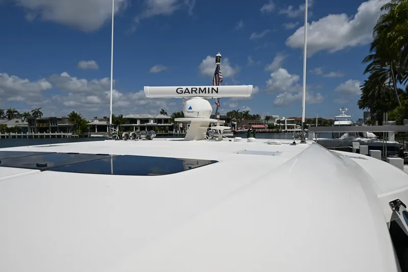  Yacht Photos Pics 2023 Tiara Yachts 48 LS with Garmin radar, docked under a clear blue sky.