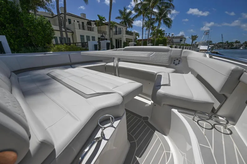  Yacht Photos Pics 2023 Tiara Yachts 48 LS luxury seating area with elegant design and waterfront view.