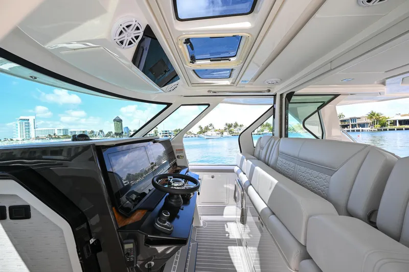  Yacht Photos Pics 2023 Tiara Yachts 48 LS interior with luxurious seating and panoramic windows.