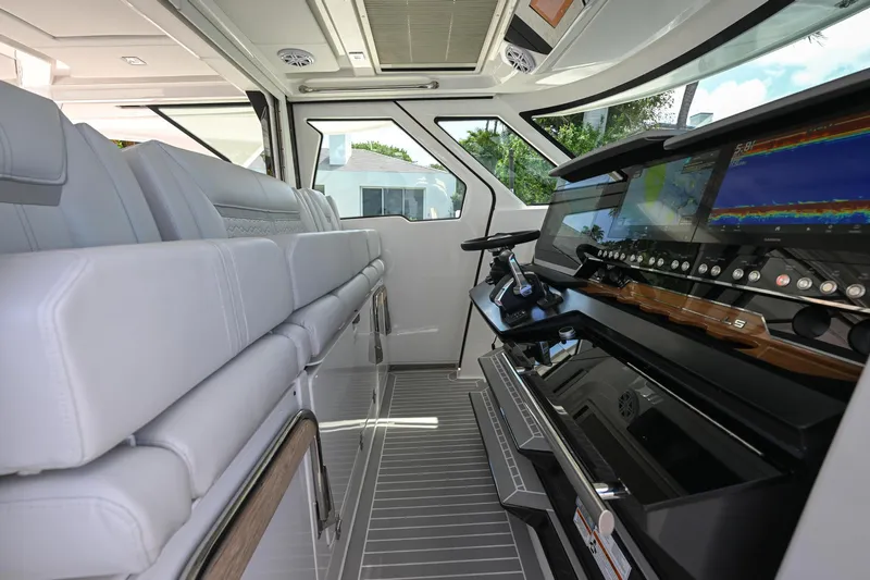  Yacht Photos Pics 2023 Tiara Yachts 48 LS interior with modern helm and seating.