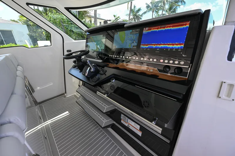  Yacht Photos Pics Helm of 2023 Tiara Yachts 48 LS with advanced navigation displays and controls.
