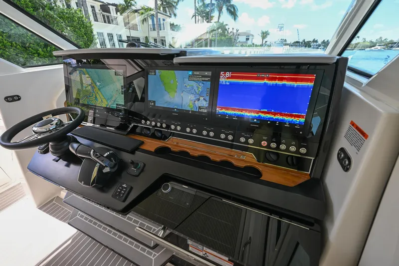  Yacht Photos Pics Helm of 2023 Tiara Yachts 48 LS with advanced navigation displays and controls.