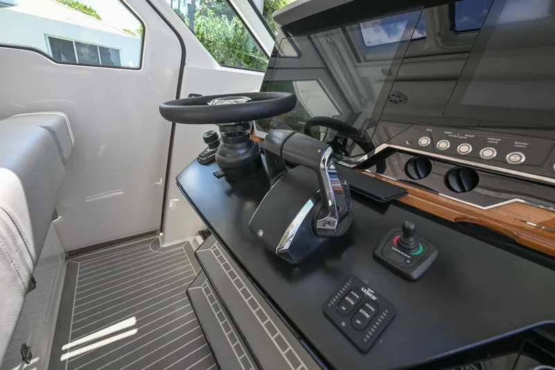  Yacht Photos Pics Helm of 2023 Tiara Yachts 48 LS with modern controls and steering wheel.