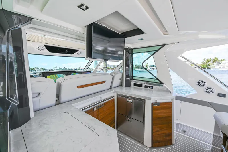  Yacht Photos Pics 2023 Tiara Yachts 48 LS interior with modern kitchen and waterfront view.