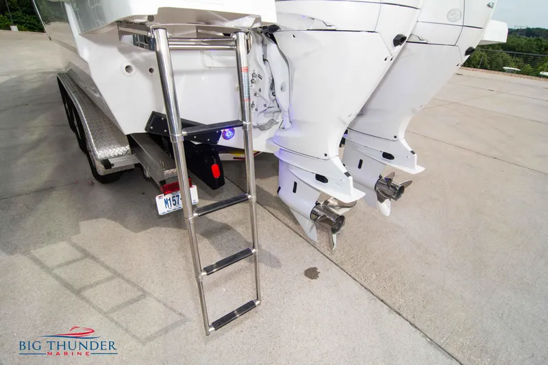  Yacht Photos Pics 2024 Jeanneau Leader 9.0 WA boat with dual outboard motors and boarding ladder.