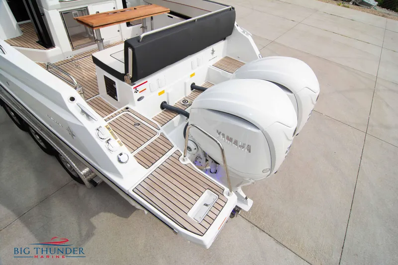  Yacht Photos Pics 2024 Jeanneau Leader 9.0 WA with twin Yamaha outboard engines on teak deck.