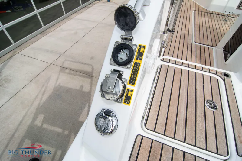  Yacht Photos Pics 2024 Jeanneau Leader 9.0 WA deck with wood finish and utility ports.