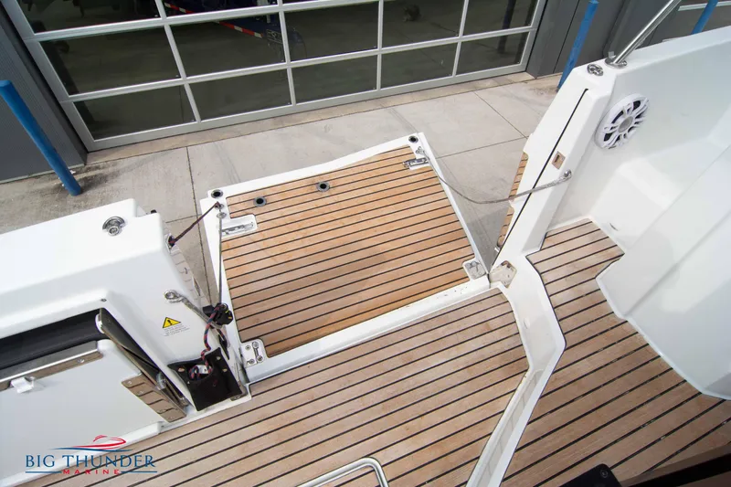  Yacht Photos Pics 2024 Jeanneau Leader 9.0 WA boat deck with teak flooring and open transom.