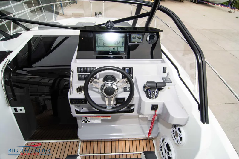  Yacht Photos Pics 2024 Jeanneau Leader 9.0 WA helm with modern controls and navigation display.