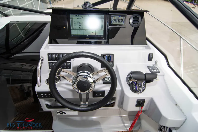  Yacht Photos Pics 2024 Jeanneau Leader 9.0 WA helm with modern controls and navigation display.