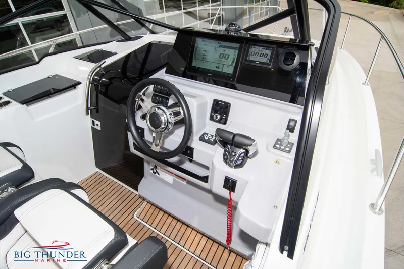  Yacht Photos Pics 2024 Jeanneau Leader 9.0 WA cockpit with modern controls and navigation displays.