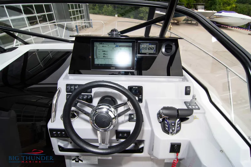  Yacht Photos Pics 2024 Jeanneau Leader 9.0 WA boat dashboard with steering wheel and control panel.
