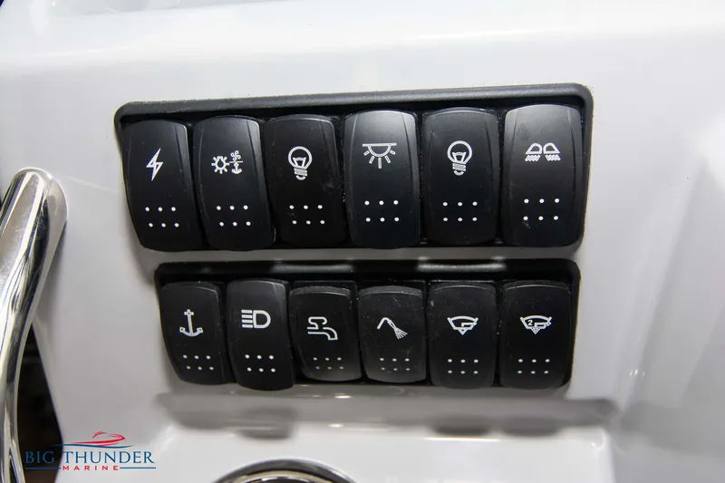  Yacht Photos Pics Control panel of 2024 Jeanneau Leader 9.0 WA boat with various switches.