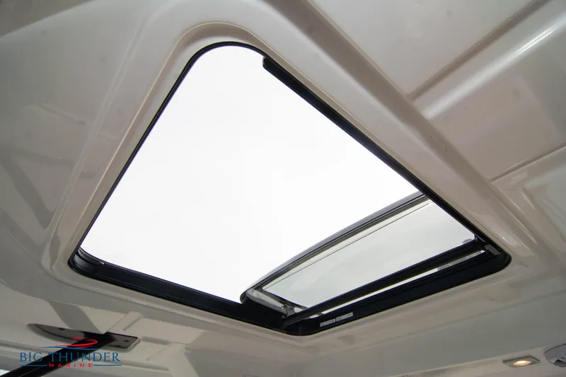  Yacht Photos Pics 2024 Jeanneau Leader 9.0 WA sunroof detail, showcasing sleek design and open sky view.