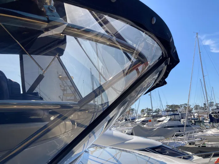  Yacht Photos Pics 2018 Sea Ray Fly 510 yacht in marina, showcasing sleek design and clear skies.