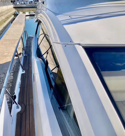  Yacht Photos Pics 2018 Sea Ray Fly 510 yacht, sleek design, docked by a canal.