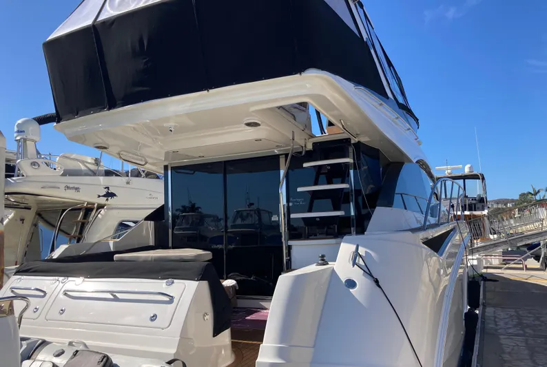  Yacht Photos Pics 2018 Sea Ray Fly 510 yacht docked at marina, rear view.