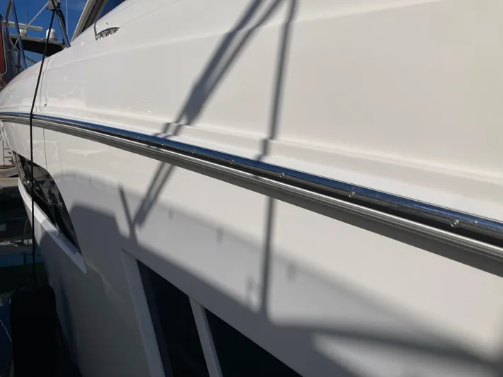  Yacht Photos Pics 2018 Sea Ray Fly 510 yacht side view with sleek white exterior.