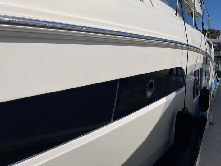  Yacht Photos Pics Close-up of 2018 Sea Ray Fly 510 yacht exterior, showcasing sleek design and detailing.