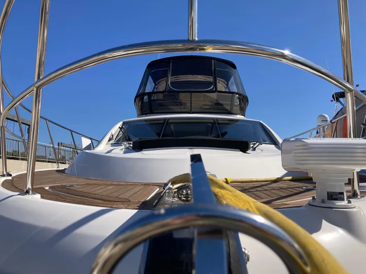  Yacht Photos Pics 2018 Sea Ray Fly 510 yacht, sleek design, docked under clear blue sky.