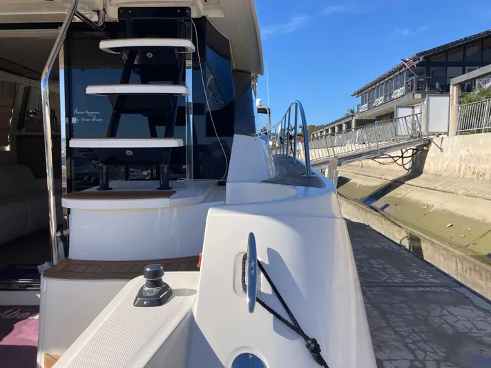  Yacht Photos Pics 2018 Sea Ray Fly 510 yacht docked, showcasing sleek design and modern features.