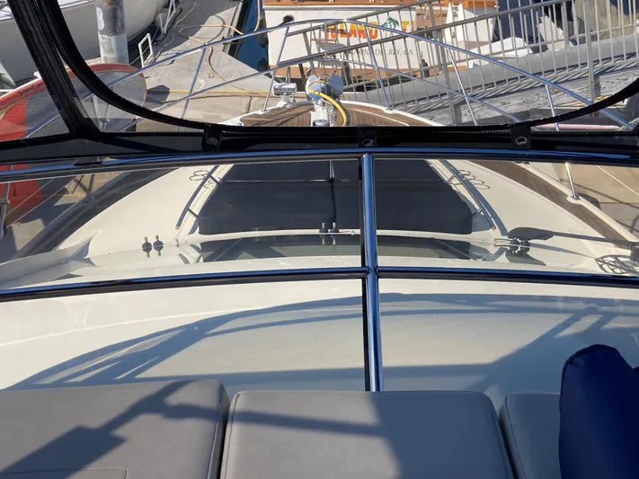  Yacht Photos Pics 2018 Sea Ray Fly 510 yacht deck view with marina background.
