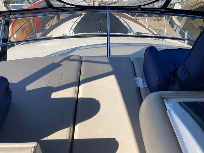  Yacht Photos Pics 2018 Sea Ray Fly 510 yacht deck with cushioned seating and railing.