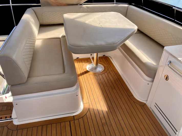  Yacht Photos Pics Luxurious seating area on 2018 Sea Ray Fly 510 yacht with elegant wood flooring.