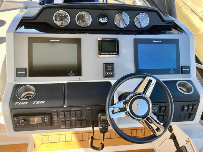  Yacht Photos Pics 2018 Sea Ray Fly 510 helm with dual Raymarine displays and modern controls.