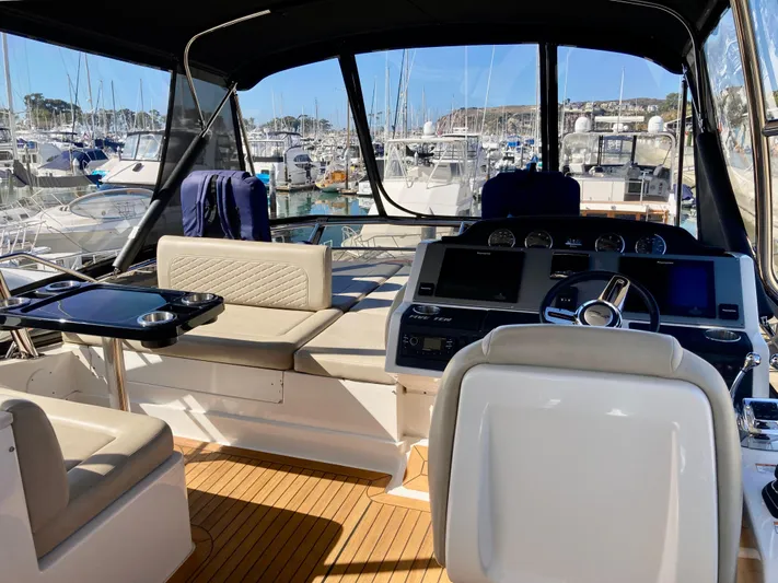  Yacht Photos Pics Luxurious 2018 Sea Ray Fly 510 yacht interior with modern helm and seating.