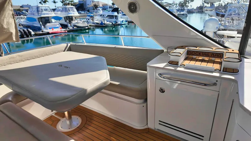  Yacht Photos Pics Luxurious 2018 Sea Ray Fly 510 yacht interior with seating and cocktail bar.