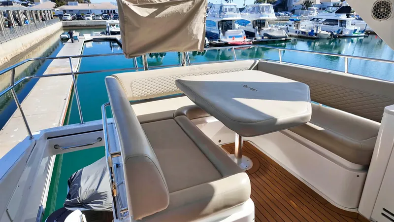  Yacht Photos Pics Luxurious 2018 Sea Ray Fly 510 yacht with elegant seating in a marina.