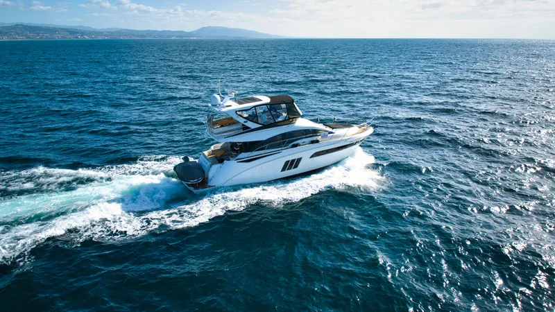  Yacht Photos Pics 2018 Sea Ray Fly 510 yacht cruising on open ocean waters.