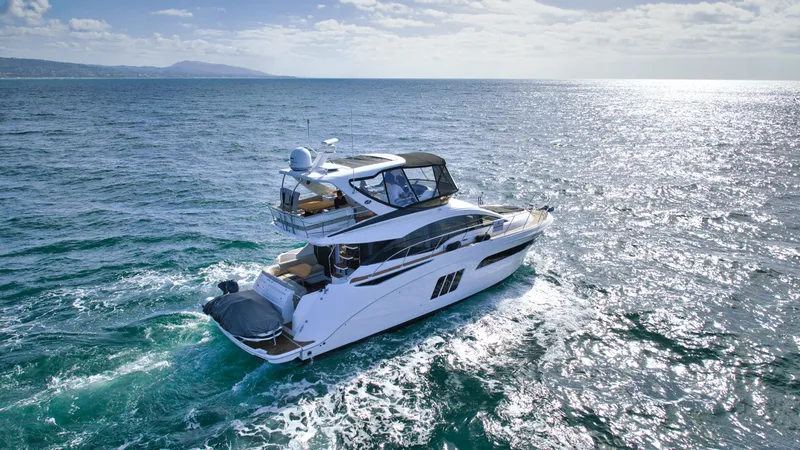  Yacht Photos Pics 2018 Sea Ray Fly 510 yacht cruising on open ocean waters.